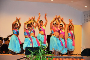 Dancers from the Indira and Nadira Shah Dance Troupe perform a cultural item at the celebrations at the Indian Monument Gardens alt