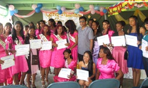 Attorney General and Minister of Legal Affairs, Mohabir Anil Nandlall flanked by the young trainees who were awarded with certificates in Cosmetology on Sunday last