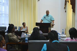 Minister in the Ministry of Finance Juan Edghill addressing participants at the closing of the 2nd Monitoring and Evaluation Training Workshop.