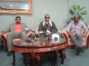 Singer R.Kelly flanked by Minister of Tourism Irfaan Ali and Organiser Odinga Lamumba yesterday