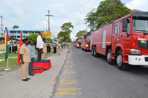 Some of the fire tenders on Brickdam while Home Affairs Minister Clement Rohee takes the march past