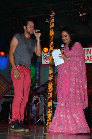 Internationally renowned artiste Jeffrey Iqbal onstage with President of the Guyana Hindu Dharmic Sabha, Member of Parliament Dr Vindhya Persaud.