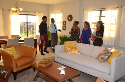 CEO, Mr. Sawh taking Mr. & Mrs. Hinds on a tour of the house