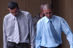 The accused: Bissoondial, Hoosman, Shamiza and Farida Khan are being escorted at their trial at the Demerara Assizes.