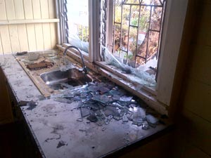 Some of the broken glass from a window in the doctor’s office can be seen in this Leroy Smith photo
