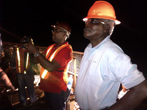 Transport Minister Robeson Benn and General Manager of the Demerara Harbour Bridge Rawlston Adams overlooking the works