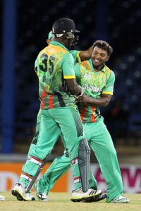 Veerasammy Permaul is congratulated by teammates for spinning out the tail in the NAGICO Super50 match on Tuesday night.