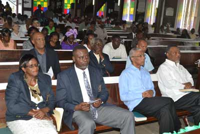 Seated in front at right is Prime Minister Samuel Hinds, to whose right is Brigadier (Ret’d) David Granger. Others in picture are, from left: Anniversary Coordinator, Ms. Vera Naughton, and President of the GPSCCU, Andrew Nestor