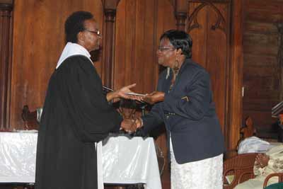 Prime Minister Samuel Hinds and Opposition Leader Brigadier (Ret’d) David Granger share some culinary delights at Duke Lodge following the Thanksgiving Service at St. Andrew’s Kirk.