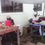 Jewel Thomas (left) trades confectionary and snacks inside the Ann’s Grove School compound 