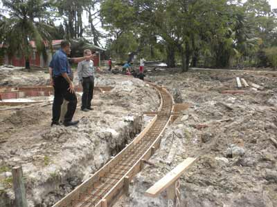 2) Minister of Natural Resources and the Environment, Mr Robert Persaud being shown around the project by Commissioner of the Protected Areas Commission, Mr. Damian Fernandes