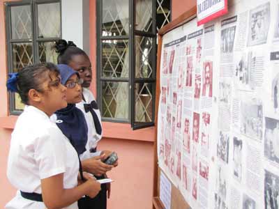 Berbice High School students viewing exhibits on the life of the late Dr Jagan