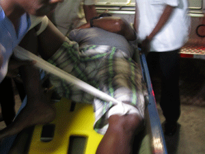 Another injured passenger from the plane crash being taken into the GPHC