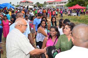 President Donald Ramotar greeting persons at the kite flying activity at Meten-Meer-Zorg