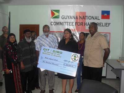 GIRO’s $500,000 contribution to Haiti Relief Fund. In photo: GIRO CEO Shazaad Khan and then Minister of Human Services and Social Security, Priya Manickchand
