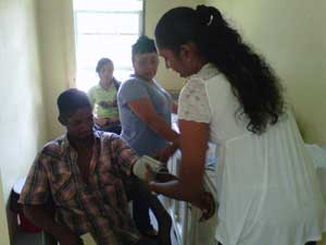 Patient at outreach receiving one of the many medical services offered by the NGO
