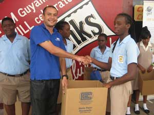 Mr. Simeon Taylor of Caribbean Containers Inc. presents cardboard receptacles to New