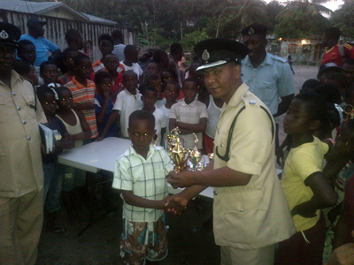 Commander Brutus presents one of the youths with his prize