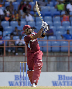 Man-of-the-Match Kieron Pollard watches the ball fly over the midwicket boundary in his top score of 89 for West Indies.