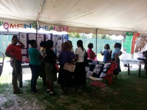 Persons visiting the various booths at the health fair yesterday (Photos by Savia Laikram)