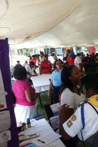 Persons visiting the various booths at the health fair yesterday (Photos by Savia Laikram)