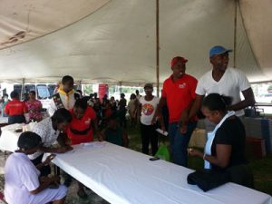 Persons visiting the various booths at the health fair yesterday (Photos by Savia Laikram)