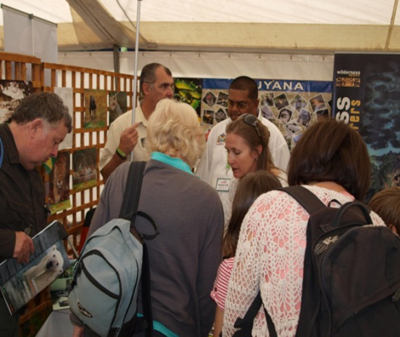Visitors at the Guyana booth