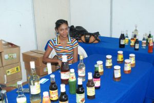 A sales representative displays some of the products manufactured by her company 