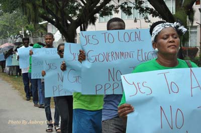APNU members and supporters protest in front of the Office of the President