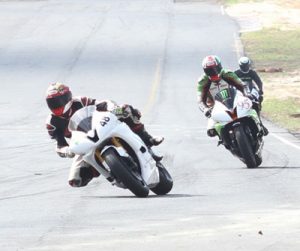 Matthew Vieira eases into the lead at the Clubhouse turn during his superb run yesterday. (Sonell Nelson photos)