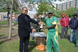Jaguar skipper Hemnarine Chattergoon receives the winning trophy from CSCA treasurer Dave Ramsammy. (Pictures courtesy of Krisho Singh Ramnarayan)