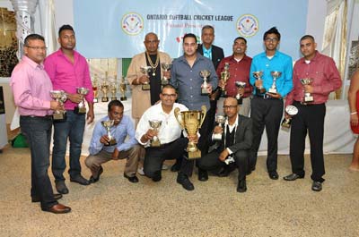 The East Coast Sports Cub players pose with the Trophy Stall Guyana Inc.-sponsored trophy among other awards. (Pictures courtesy of Bobby Ramlagan)