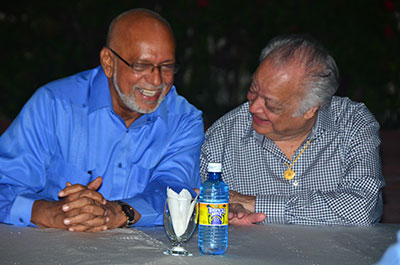‘HEARTY LAUGH’: President Donald Ramotar and Sir Shridath Ramphal share a light moment at last evening’s book launch at Georgetown Club.