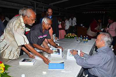 ‘AUTOGRAPH’: Persons trying to make sure they get Sir Shridath Ramphal’s autograph in their personal copies of his book