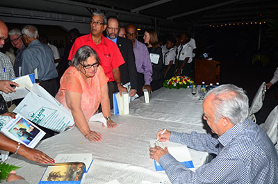 ‘AUTOGRAPH’: Persons trying to make sure they get Sir Shridath Ramphal’s autograph in their personal copies of his book