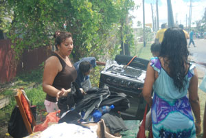Evelyn Rupchand being consoled by her daughter yesterday following the fire