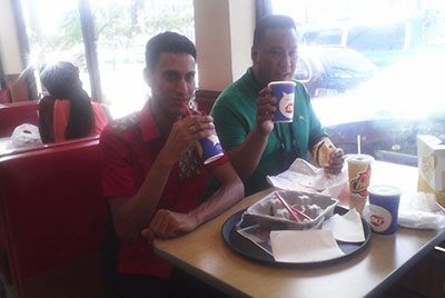 Veteran fashion designer, Maxi Williams (left) and friends were among the excited groups sampling the delicacies DQ has to offer