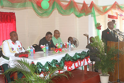 President of the Guyana Veterans Legion, Col. (Ret’d) George Gomes addresses the gathering. In the background Prime Minister Samuel Hinds, is flanked by (at left) Brigadier Mark Phillips and the Legion’s Vice President, Col. (Ret’d) Frank Bispham