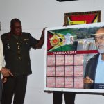 President Donald Ramotar and Brigadier Mark Phillips viewing a depiction of the GDF’s 50th Anniversary Calendar 