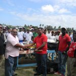 President Drubahadur hands over cricket kit to Christopher Singh from Lusignan. Also in photo are: Jitlall Jowharilall of Enterprise at right, Delbert Hicks from Rose Hall Town Youth and Sports Club and GCB secretary Anand Sanasie at left.