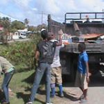 Workers loading solid waste onto a truck on the Essequibo Coast during the ‘Clean-up My Country’ exercise 