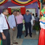 Minister of Culture, Youth and Sport, Dr Frank Anthony; Prime Minister Samuel Hinds, and members of the diplomatic corps viewing a piece at the exhibition 