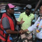 President Ramotar meeting a speedboat operator at Supenaam