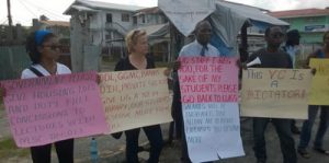 UG’s Vice-Chancellor, Professor Jacob Opadeyi (second right) leads a picketing exercise of his own, which was supported by his daughter and a UG staffer (first and second left respectively). At right is a student activist who had his own grouse