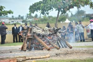 Little Mark Anthony’s body being cremated at the Good Hope Cremation site yesterday (Photos by Samuel Maughn) 