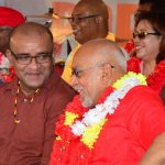 Incumbent President, Donald Ramotar, and former president, Dr Bharrat Jagdeo, share a light moment during yesterday’s rally[Photos by Adrian Narine)