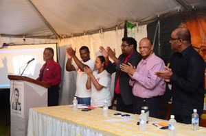 Prime Minister Samuel Hinds gets a rousing applause when he took to the podium to speak on Friday evening. Among those leading the applause are former President Dr Bharrat Jagdeo, PPP General Secretary Mr Clement Rohee; and PYO Chairman Mr Irfaan Ali