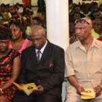 Crum Ewing’s mother, stepfather and father seated as the tributes for the dead man are read
