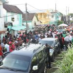 A section of the crowd outside the Albouystown church yesterday