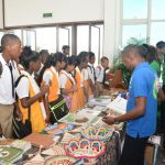 Secondary school students showing keen interest in a booth showcasing forestry products at the exhibition to commemorate International Day of Forests and the Tree yesterday 